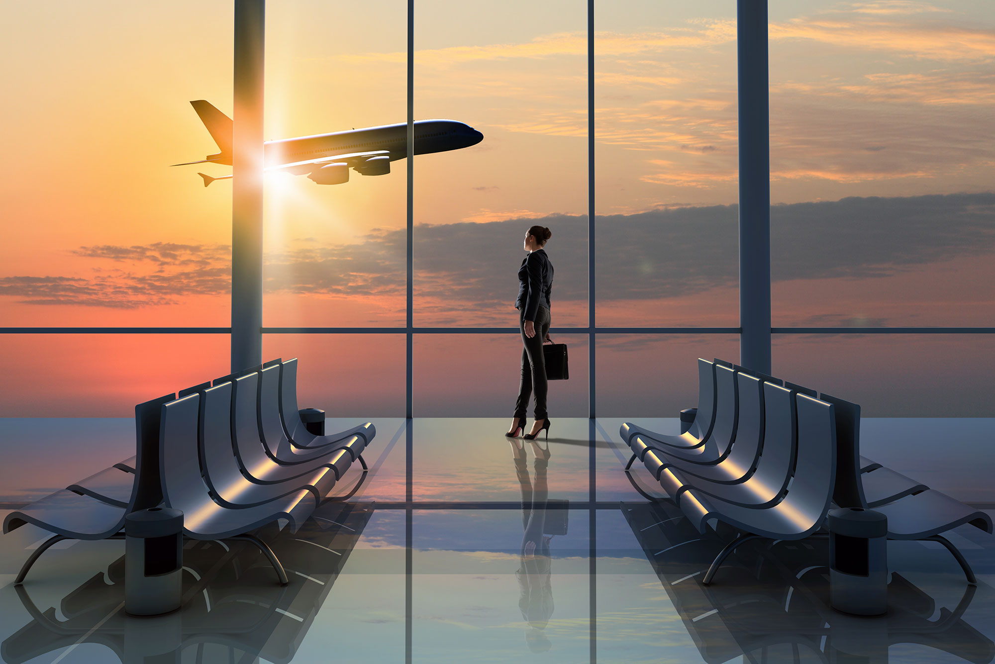 Woman watching aircraft take off
